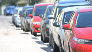 row of cars lined up on the street