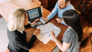 Group of people looking over novated lease vehicle costs